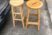 2 solid wood bar stools.