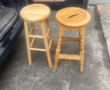 2 solid wood bar stools.