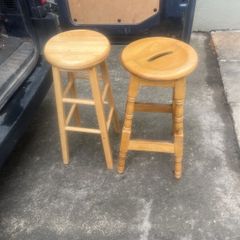 2 solid wood bar stools.