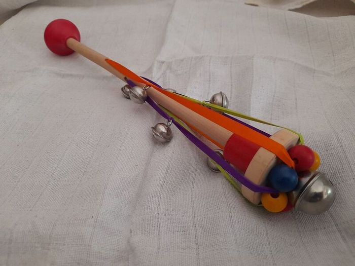 Child's wooden rattle with bells