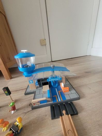 wooden train play set with two electric locomotives and lots of parts