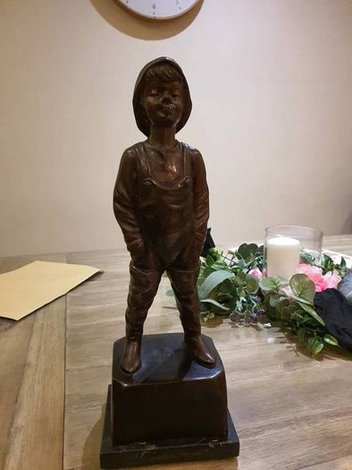 Fisher boy, bronze statue