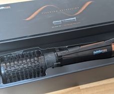 Rotating brush hair dryer