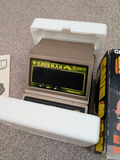 Grandstand Cave man handheld for repair