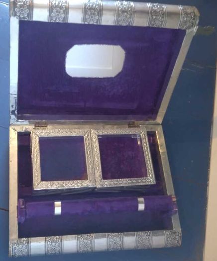 Book-shaped silver jewellery box with purple velvet lining