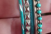 Charming bracelets in silver and blue tones.