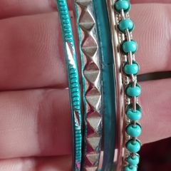 Charming bracelets in silver and blue tones.