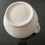 Vintage ceramic pitcher with embossed decoration Image 6