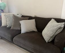 3 seater sofa with brown stained legs & Helen Turkington cushions