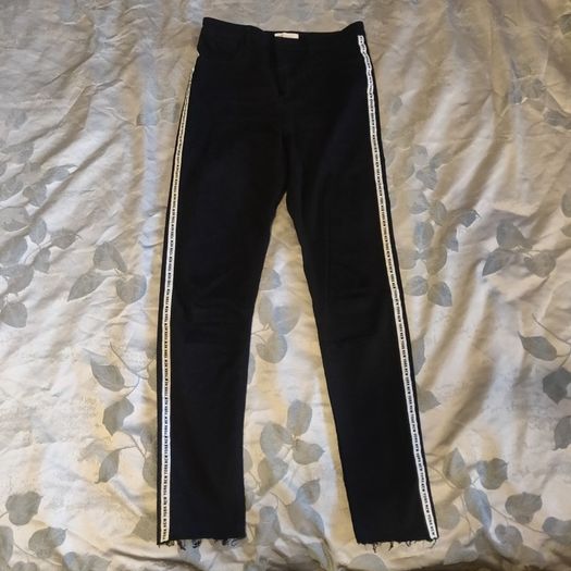Black stretchy jeans with white stripes, size S, like new