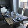 Solid reclaimed wood dining table w/ thick wood plank top. Quality construction. Seats 4-6. Natural patina. Imported from the US. Image 5