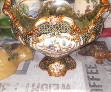 Beautiful Old Decorative Majolica Centerpiece Features a Handle and Scalloped Edges with Floral and Lattice Patterns, characterized by its colorful glazes and intricate molded designs, This type of pottery was popular in the 19th and early 20th centuries,