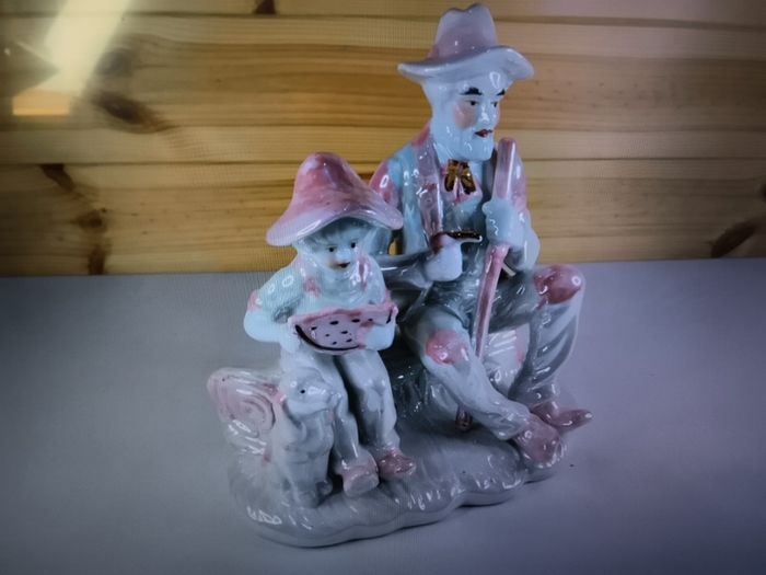 Vintage Porcelain Man with a Girl Eating WaterMelon God Log