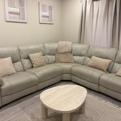 Cream leather reclining sofa with charging ports