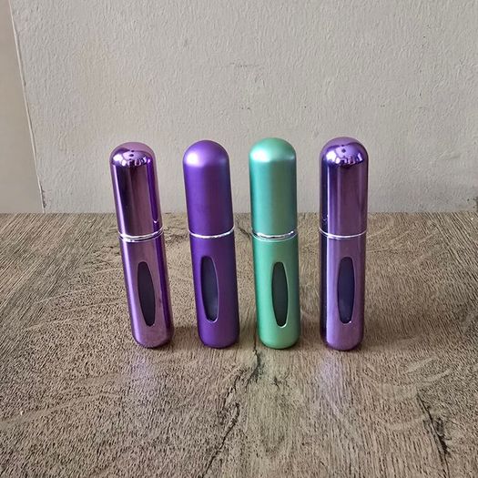 4 mini perfume spray bottles