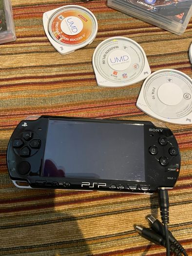 PSP  Console plus 10 games, charger and headphones