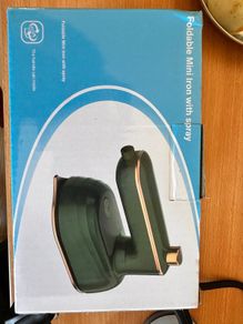 Portable iron (clothes steamer)