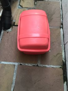 Large plastic storage boxes with covers.