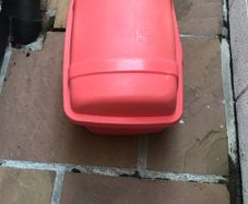 Large plastic storage boxes with covers.