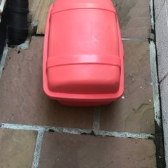 Large plastic storage boxes with covers.