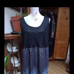 Ladies dress black lined lace top and decorated bottom half, new never worn.