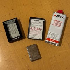 Original Zippo Petrol Lighter Quit smoking. Included: - Zippo lighter like new in its box - Fuel canister about 90% full - Bic lighter