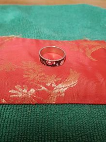 Ring with floral accents.