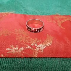 Ring with floral accents.