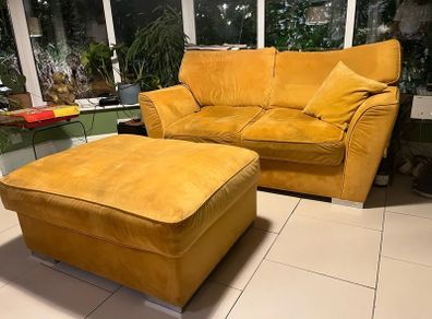 Mustard yellow velvet sofa with matching footstool
