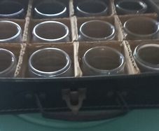 vintage set of 12 jars in lovely leather carry case