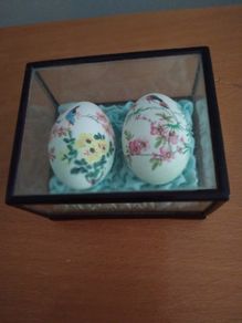 Two oriental hand painted eggs