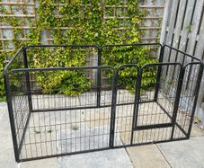 Black metal dog pen