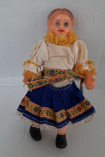 Small vintage rubber doll in costume