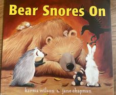 Book Bear snores on