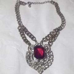 a lovely vintage  costome jewelley pendent with white stones and a large red stone