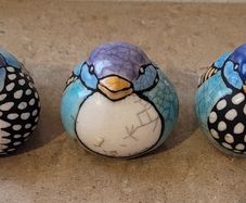 Mid-century trio of handpainted ceramic birds