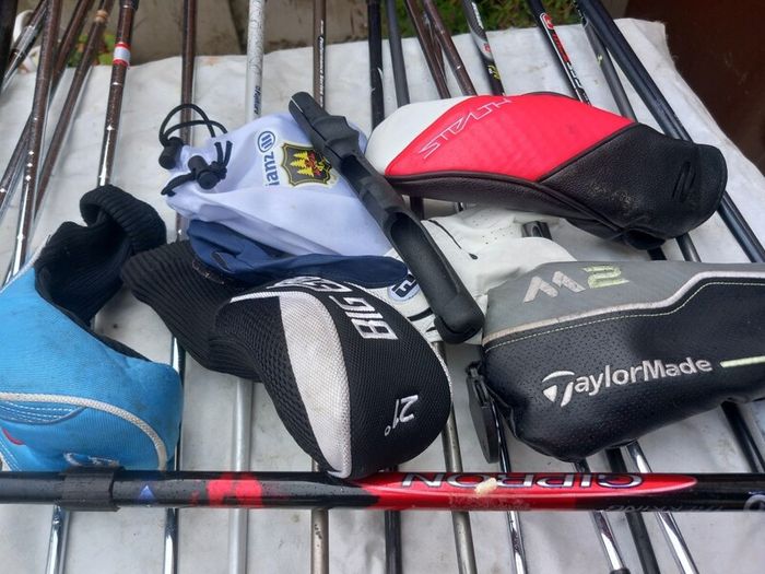 A selection of golf clubs and bags. NOT SELLING SEPARATE