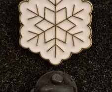 Snowflake,  pin back badge.