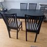 Black dining table with four chairs Image 4