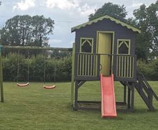 Playhouse with slide and swings