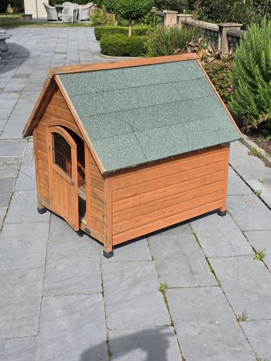 Wooden pet house with green felt roof