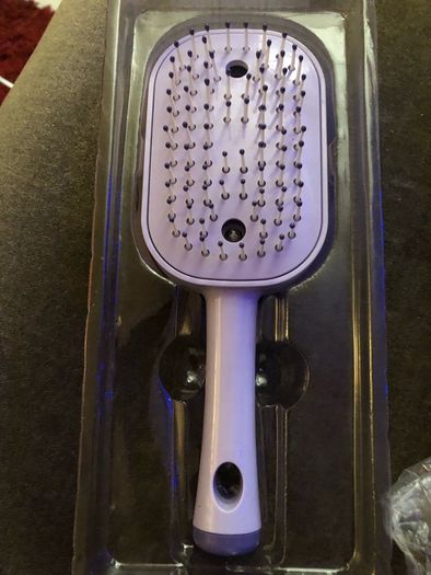Electric spray comb