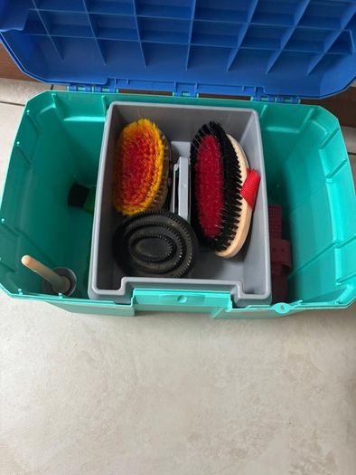 Equestrian tack box with 9 horse brushes
