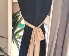 Black pleated dress with contrast belt