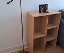 Vintage style floor lamp with chair and bookshelf