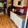 Cream Kitchen with Solid Oak Worktops + integrated Dishwasher & Fridge/Freezer + new Quartz black Sink & Mixer Tap Image 6