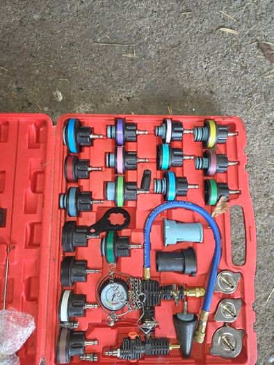 Coolant pressure tester and vacuum bleeder