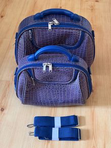Blue alligator style travel accessory bags