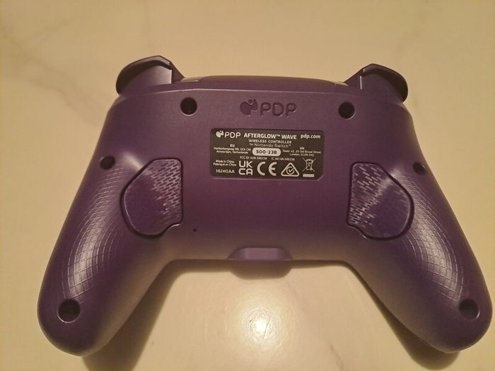 Nintendo Switch PDP Afterglow Wave Purple controller