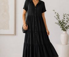 NEW black dress features a tiered skirt and short sleeves